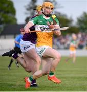 17 May 2023; Cormac Egan of Offaly in action against Seán Rowley of Wexford during the oneills.com Leinster GAA Hurling U20 Championship Final match between Offaly and Wexford at Netwatch Cullen Park in Carlow. Photo by Stephen Marken/Sportsfile