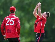 18 May 2023; Curtis Campher of Munster Reds catches out Fionn Hand of Leinster Lightning during the Rario Inter-Provincial Cup match between Leinster Lightning and Munster Reds at Pembroke Cricket Club in Dublin. Photo by Tyler Miller/Sportsfile