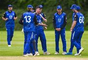 18 May 2023; Reuben Wilson of Leinster Lightning, centre, celebrates with teammates after taking the wicket of Murray Commins of Munster Reds during the Rario Inter-Provincial Cup match between Leinster Lightning and Munster Reds at Pembroke Cricket Club in Dublin. Photo by Tyler Miller/Sportsfile