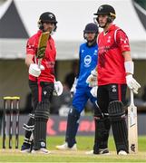 18 May 2023; Tyrone Kane of Munster Reds, left, celebrates with teammate PJ Moor, after bringing up his half century during the Rario Inter-Provincial Cup match between Leinster Lightning and Munster Reds at Pembroke Cricket Club in Dublin. Photo by Tyler Miller/Sportsfile