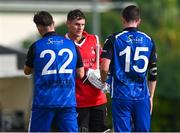 18 May 2023; PJ Moor of Munster Reds shakes hands with Fionn Hand of Leinster Lightning, left, and Reuben Wilson after the Rario Inter-Provincial Cup match between Leinster Lightning and Munster Reds at Pembroke Cricket Club in Dublin. Photo by Tyler Miller/Sportsfile