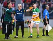17 May 2023; Charlie Mitchell of Offaly with his manager Leo O'Connor after he was sent off by referee Thomas Gleeson, not pictured, during the oneills.com Leinster GAA Hurling U20 Championship Final match between Offaly and Wexford at Netwatch Cullen Park in Carlow. Photo by Piaras Ó Mídheach/Sportsfile