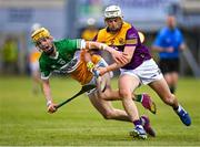 17 May 2023; Darragh Carley of Wexford in action against Dan Bourke of Offaly during the oneills.com Leinster GAA Hurling U20 Championship Final match between Offaly and Wexford at Netwatch Cullen Park in Carlow. Photo by Piaras Ó Mídheach/Sportsfile