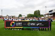 19 May 2023; Shelbourne players hold an LGBT Ireland banner, a part of SSE Airtricity's LGBT Ireland Football takeover initiative, before the SSE Airtricity Men's Premier Division match between Shelbourne and St Patrick's Athletic at Tolka Park in Dublin. Photo by Stephen McCarthy/Sportsfile