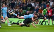 19 May 2023; Baptiste Serin of RC Toulon scores his side's first try despite the tackle of Ollie Smith of Glasgow Warriors during the EPCR Challenge Cup Final match between Glasgow Warriors and RC Toulon at Aviva Stadium in Dublin. Photo by Brendan Moran/Sportsfile