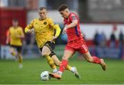 19 May 2023; Matty Smith of Shelbourne in action against Jamie Lennon of St Patrick's Athletic during the SSE Airtricity Men's Premier Division match between Shelbourne and St Patrick's Athletic at Tolka Park in Dublin. Photo by Stephen McCarthy/Sportsfile