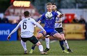 19 May 2023; Kris Twardek of Bohemians in action against Alfie Lewis, left, and Robbie McCourt of Dundalk during the SSE Airtricity Men's Premier Division match between Dundalk and Bohemians at Oriel Park in Dundalk, Louth. Photo by Ramsey Cardy/Sportsfile