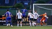 19 May 2023; Jordan Flores of Bohemians, left, scores his side's second goal past Dundalk goalkeeper Nathan Shepperd during the SSE Airtricity Men's Premier Division match between Dundalk and Bohemians at Oriel Park in Dundalk, Louth. Photo by Ramsey Cardy/Sportsfile
