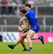 20 May 2023; Conor O'Donnell of Donegal in action against Cillian Rouine of Clare during the GAA Football All-Ireland Senior Championship Round 1 match between Clare and Donegal at Cusack Park in Ennis, Clare. Photo by Ray McManus/Sportsfile