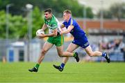 20 May 2023; Caolan McGonagle of Donegal is tackled by Pearse Lillis of Clare during the GAA Football All-Ireland Senior Championship Round 1 match between Clare and Donegal at Cusack Park in Ennis, Clare. Photo by Ray McManus/Sportsfile