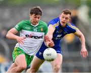 20 May 2023; Conor O'Donnell of Donegal is tackled by Darragh Bohannon of Clare during the GAA Football All-Ireland Senior Championship Round 1 match between Clare and Donegal at Cusack Park in Ennis, Clare. Photo by Ray McManus/Sportsfile