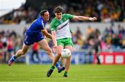 20 May 2023; Conor O'Donnell of Donegal is tackled by Cathal O'Connor of Clare during the GAA Football All-Ireland Senior Championship Round 1 match between Clare and Donegal at Cusack Park in Ennis, Clare. Photo by Ray McManus/Sportsfile