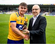 20 May 2023; Pictured is James Hegarty from Clare being presented with the Electric Ireland Player of the Match award by Liam O'Mahoney from GAA Post Primary following his performance in the Electric Ireland GAA Hurling All-Ireland Minor Championship Semi-Final . Photo by Stephen Marken/Sportsfile