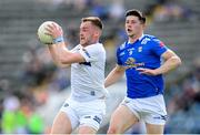 13 May 2023; Eoin Lowry of Laois in action against James Smith of Cavan during the Tailteann Cup Group 1 Round 1 match between Cavan and Laois at Kingspan Breffni in Cavan. Photo by Stephen McCarthy/Sportsfile