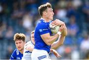 13 May 2023; Conor Brady of Cavan is tackled by Evan O’Carroll of Laois during the Tailteann Cup Group 1 Round 1 match between Cavan and Laois at Kingspan Breffni in Cavan. Photo by Stephen McCarthy/Sportsfile