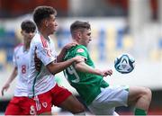 20 May 2023; Mason Melia of Republic of Ireland in action against Brayden Clarke of Wales during the UEFA European U17 Championship Final Tournament match between Republic of Ireland and Wales at Pancho Aréna in Felcsút, Hungary. Photo by David Balogh/Sportsfile