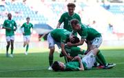 20 May 2023; Ikechukwu Orazi of Republic of Ireland, 11, celebrates with teammates after scoring their side's second goal during the UEFA European U17 Championship Final Tournament match between Republic of Ireland and Wales at Pancho Aréna in Felcsút, Hungary. Photo by David Balogh/Sportsfile