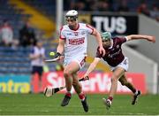 20 May 2023; Barry Walsh of Cork in action against Aaron Niland of Galway during the Electric Ireland GAA Hurling All-Ireland Minor Championship Semi-Final match between Galway and Cork at FBD Semple Stadium in Thurles, Tipperary. Photo by Stephen Marken/Sportsfile