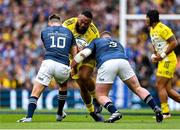 20 May 2023; Uini Atonio of La Rochelle is tackled by Ross Byrne, left, and Tadhg Furlong of Leinster during the Heineken Champions Cup Final match between Leinster and La Rochelle at Aviva Stadium in Dublin. Photo by Brendan Moran/Sportsfile