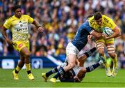 20 May 2023; Paul Boudehent of La Rochelle is tackled by Jamison Gibson-Park, bottom, and Hugo Keenan of Leinster during the Heineken Champions Cup Final match between Leinster and La Rochelle at Aviva Stadium in Dublin. Photo by Brendan Moran/Sportsfile
