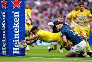 20 May 2023; Jonathan Danty of La Rochelle scores his side's first try despite the tackle of Robbie Henshaw of Leinster during the Heineken Champions Cup Final match between Leinster and La Rochelle at Aviva Stadium in Dublin. Photo by Brendan Moran/Sportsfile
