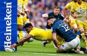 20 May 2023; Jonathan Danty of La Rochelle scores his side's first try despite the tackle of Robbie Henshaw of Leinster during the Heineken Champions Cup Final match between Leinster and La Rochelle at Aviva Stadium in Dublin. Photo by Brendan Moran/Sportsfile
