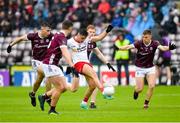 20 May 2023; Michael Mc Kernan  of Tyrone in action against Matthew Tierney, Peter Cooke and Dylan McHugh of Galway during the GAA Football All-Ireland Senior Championship Round 1 match between Galway and Tyrone at Pearse Stadium in Galway. Photo by Ray Ryan/Sportsfile