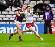 20 May 2023; Matthew Donnelly of Tyrone in action against Damien Comer of Galway during the GAA Football All-Ireland Senior Championship Round 1 match between Galway and Tyrone at Pearse Stadium in Galway. Photo by Ray Ryan/Sportsfile