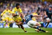 20 May 2023; UJ Seuteni of La Rochelle is tackled by Hugo Keenan of Leinster during the Heineken Champions Cup Final match between Leinster and La Rochelle at Aviva Stadium in Dublin. Photo by Ramsey Cardy/Sportsfile