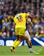 20 May 2023; Caelan Doris of Leinster is tackled by Jonathan Danty of La Rochelle, resulting in a yellow card for Jonathan Danty, during the Heineken Champions Cup Final match between Leinster and La Rochelle at Aviva Stadium in Dublin. Photo by Brendan Moran/Sportsfile