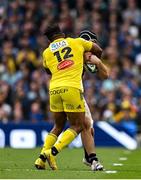 20 May 2023; Caelan Doris of Leinster is tackled by Jonathan Danty of La Rochelle, resulting in a yellow card for Jonathan Danty, during the Heineken Champions Cup Final match between Leinster and La Rochelle at Aviva Stadium in Dublin. Photo by Brendan Moran/Sportsfile