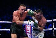 20 May 2023; Dennis Hogan, right, and James Metcalf during their IBO world super-welterweight title fight at the 3Arena in Dublin. Photo by Stephen McCarthy/Sportsfile