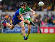 20 May 2023; Conor O'Donnell of Donegal is tackled by Cathal O'Connor of Clare during the GAA Football All-Ireland Senior Championship Round 1 match between Clare and Donegal at Cusack Park in Ennis, Clare. Photo by Ray McManus/Sportsfile