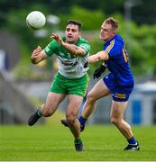 20 May 2023; Caolan McGonagle of Donegal in action against Pearse Lillis of Clare during the GAA Football All-Ireland Senior Championship Round 1 match between Clare and Donegal at Cusack Park in Ennis, Clare. Photo by Ray McManus/Sportsfile