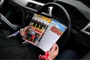 21 May 2023; A Cork supporter reads her programme in advance of the Munster GAA Hurling Senior Championship Round 4 match between Clare and Cork at Cusack Park in Ennis, Clare. Photo by Ray McManus/Sportsfile