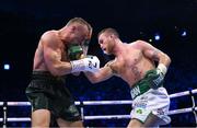 20 May 2023; Dennis Hogan, right, and James Metcalf during their IBO world super-welterweight title fight at the 3Arena in Dublin. Photo by Stephen McCarthy/Sportsfile