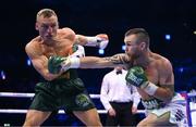 20 May 2023; Dennis Hogan, right, and James Metcalf during their IBO world super-welterweight title fight at the 3Arena in Dublin. Photo by Stephen McCarthy/Sportsfile