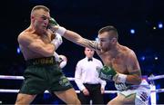 20 May 2023; Dennis Hogan, right, and James Metcalf during their IBO world super-welterweight title fight at the 3Arena in Dublin. Photo by Stephen McCarthy/Sportsfile