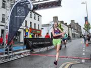 21 May 2023; Heather Murphy of St Michael's AC, Laois, crosses the line to finish as third women during the Ashling Murphy 4 Miler, part of the Peugeot Race Series, in Tullamore, Offaly. Photo by Harry Murphy/Sportsfile