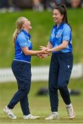 21 May 2023; Typhoons bowler Freya Sargent, left, celebrates with teammate Ava Canning after claiming the wicket of Scorchers' Gaby Lewis during the Evoke Super Series match between Typhoons and Scorchers at Oak Hill Cricket Club in Kilbride, Wicklow. Photo by Seb Daly/Sportsfile