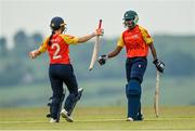 21 May 2023; Scorchers batter Mary-Anne Musonda, right, is congratulated by teammate Annabelle Squires after scoring a half-century during the Evoke Super Series match between Typhoons and Scorchers at Oak Hill Cricket Club in Kilbride, Wicklow. Photo by Seb Daly/Sportsfile