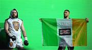 20 May 2023; Thomas Carty is walked to the ring by UFC figher Johnny Walker for his vacant Boxing Union of Ireland celtic heavyweight title fight with Jay McFarlane at the 3Arena in Dublin. Photo by Stephen McCarthy/Sportsfile