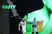 20 May 2023; Thomas Carty is walked to the ring by UFC figher Johnny Walker for his vacant Boxing Union of Ireland celtic heavyweight title fight with Jay McFarlane at the 3Arena in Dublin. Photo by Stephen McCarthy/Sportsfile