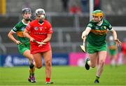 21 May 2023; Rachel Harty of Cork races clear of Áine O'Connor, left, and Kate Lynch of Kerry during the Munster Intermediate Camogie Final match between Cork and Kerry at Cusack Park in Ennis, Clare. Photo by Ray McManus/Sportsfile