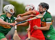 21 May 2023; Cliona O'Callaghan of Cork is tackled by Sara Murphy, right, and Patrice Diggin of Kerry during the Munster Intermediate Camogie Final match between Cork and Kerry at Cusack Park in Ennis, Clare. Photo by Ray McManus/Sportsfile