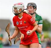 21 May 2023; Cliona O'Callaghan of Cork is tackled by Sara Murphy of Kerry during the Munster Intermediate Camogie Final match between Cork and Kerry at Cusack Park in Ennis, Clare. Photo by Ray McManus/Sportsfile