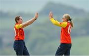 21 May 2023; Scorchers bowler Sophie MacMahon, left, and teammate Gaby Lewis celebrate claiming the wicket of Typhoons batter Robyn Searle during the Evoke Super Series match between Typhoons and Scorchers at Oak Hill Cricket Club in Kilbride, Wicklow. Photo by Seb Daly/Sportsfile