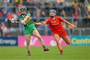 21 May 2023; Caoimhe Spillane of Kerry is tackled by Rose Murphy of Cork during the Munster Intermediate Camogie Final match between Cork and Kerry at Cusack Park in Ennis, Clare. Photo by Ray McManus/Sportsfile
