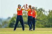 21 May 2023; Scorchers bowler Ellie McGee is congratulated by teammate Gaby Lewis after claiming the wicket of Typhoons batter Georgina Dempsey during the Evoke Super Series match between Typhoons and Scorchers at Oak Hill Cricket Club in Kilbride, Wicklow. Photo by Seb Daly/Sportsfile