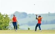 21 May 2023; Mary-Anne Musonda of Scorchers, right, catches Typhoons batter Georgia Atkinson in the outfield during the Evoke Super Series match between Typhoons and Scorchers at Oak Hill Cricket Club in Kilbride, Wicklow. Photo by Seb Daly/Sportsfile